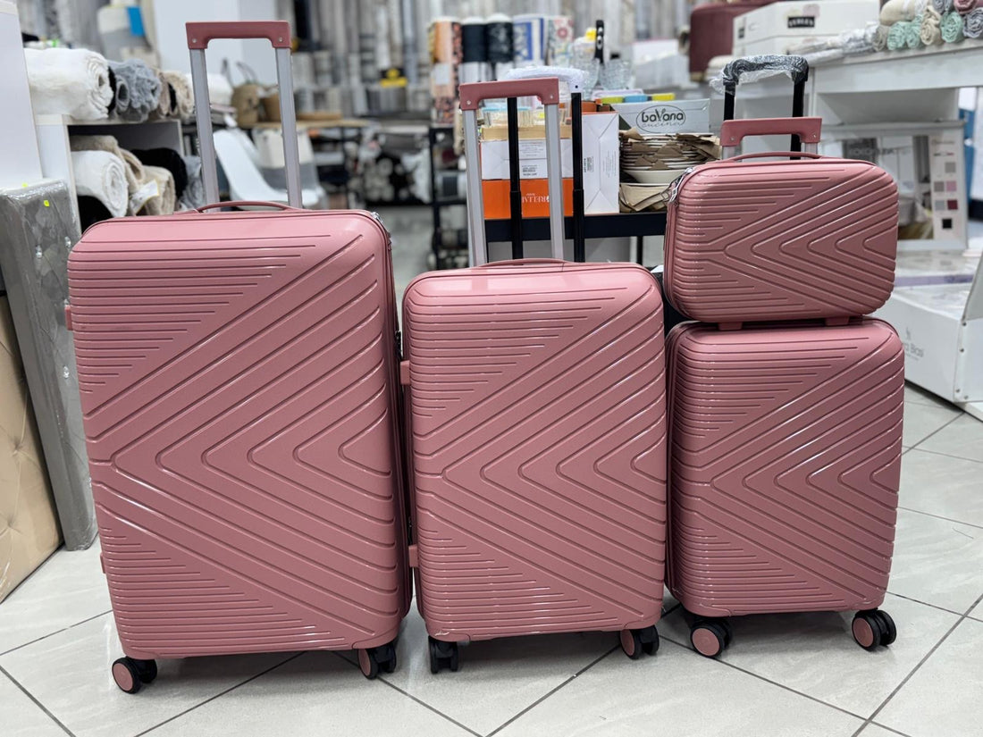 Set di 4 valigie in ABS rigido rosa
