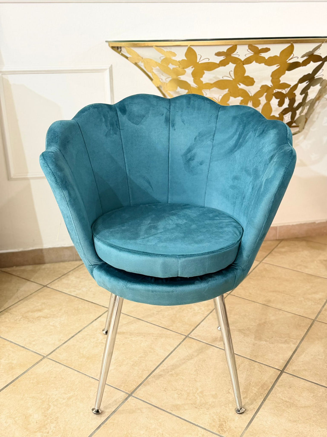 Poltrona ottanio con gambe argento